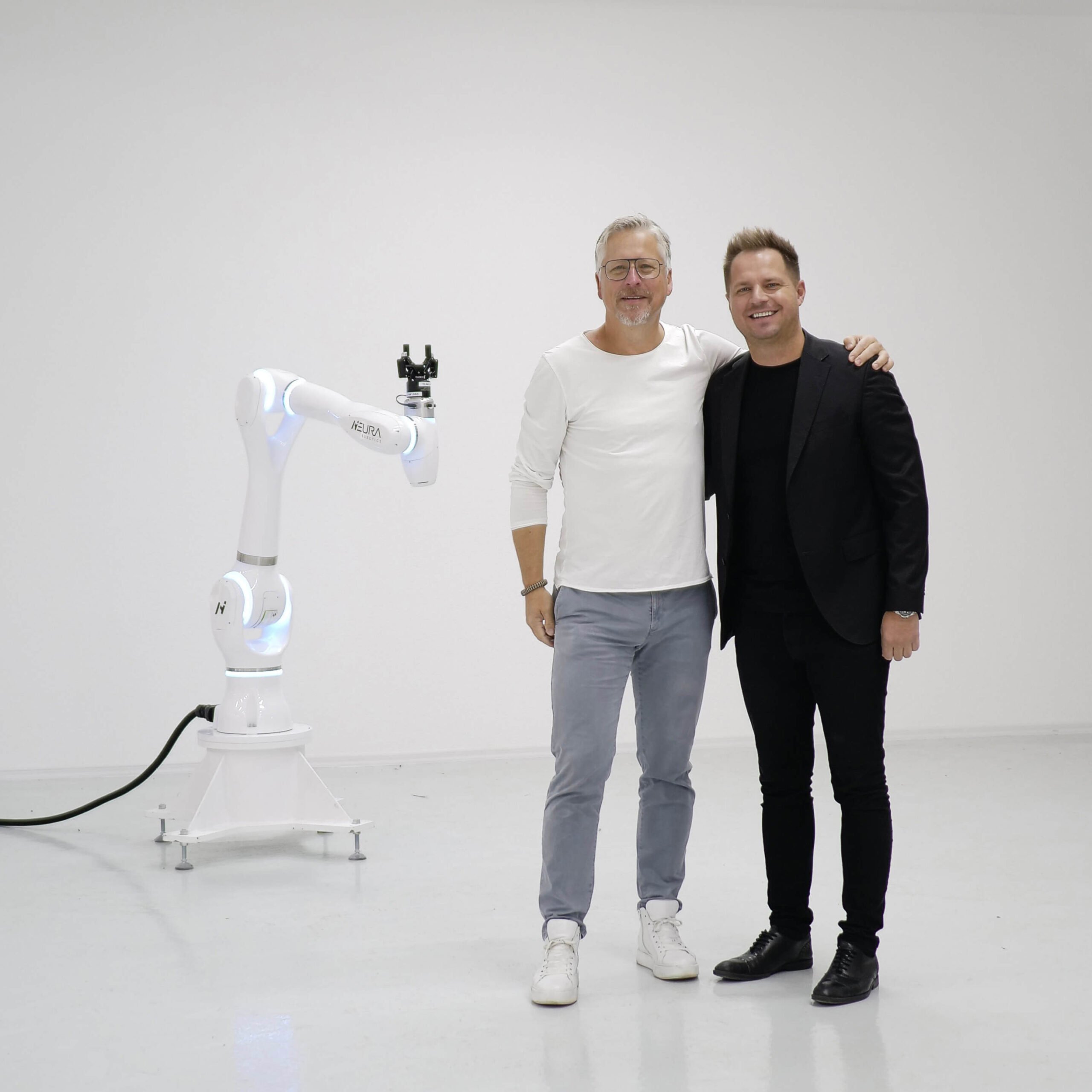 Chief Growth Officer Dr. Bernd Heinrichs with NEURA Robotics founder and CEO David Reger