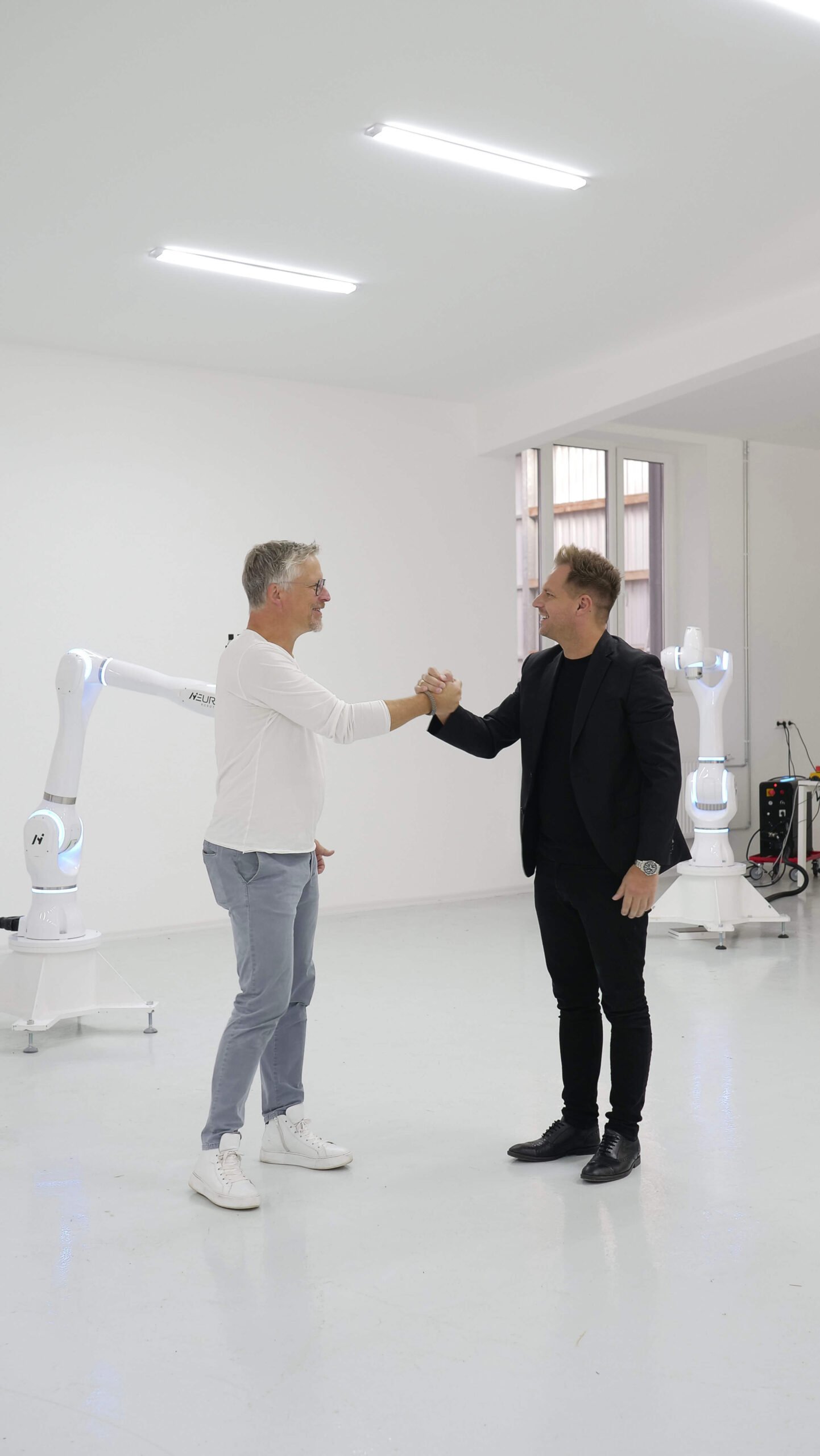 Chief Growth Officer Dr. Bernd Heinrichs with NEURA Robotics founder and CEO David Reger