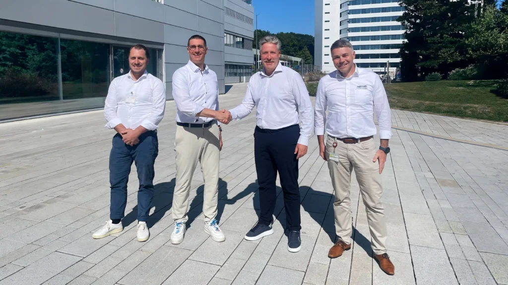 bosch and neura mobile robots representants handshake